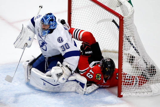Chicago Blackhawks center Jonathan Toews (19) crashes into