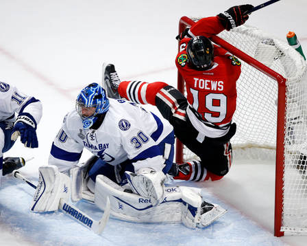Chicago Blackhawks center Jonathan Toews (19) crashes into