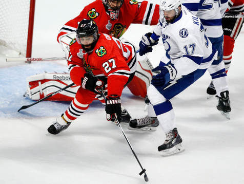 Chicago Blackhawks defenseman Johnny Oduya (27) advances