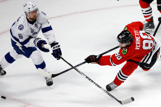 Chicago Blackhawks center Antoine Vermette (80) shoots past