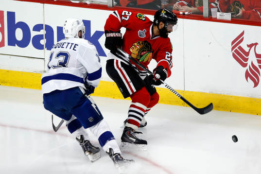 Chicago Blackhawks defenseman Johnny Oduya (27) battles
