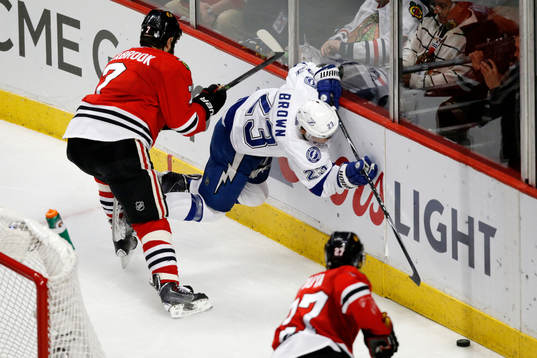 Tampa Bay Lightning right wing J.T. Brown (23) hits the