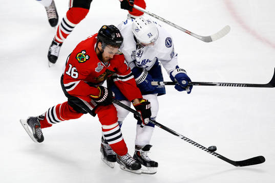 Chicago Blackhawks center Marcus Kruger (16) and Tampa Bay