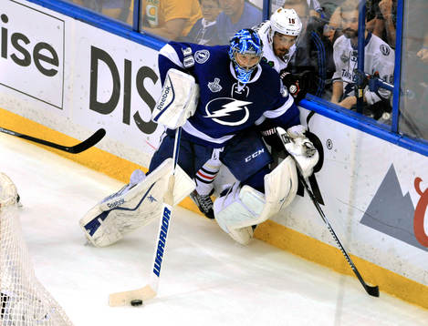 Tampa bay goalie Ben Bishop (30) clears the puck away from