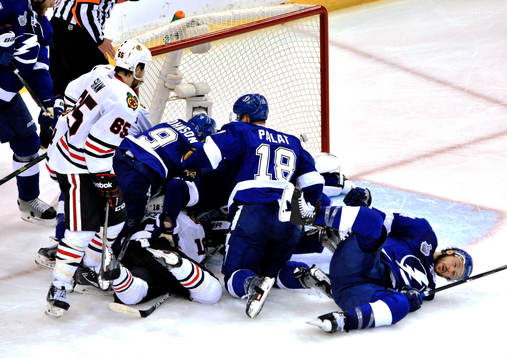 Chicago's Andrew Shaw (65) and Tampa Bay's Tyler Johnson