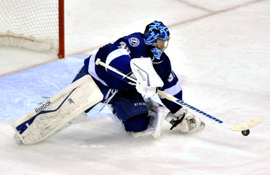Tampa bay goalie Ben Bishop reaches for the puck