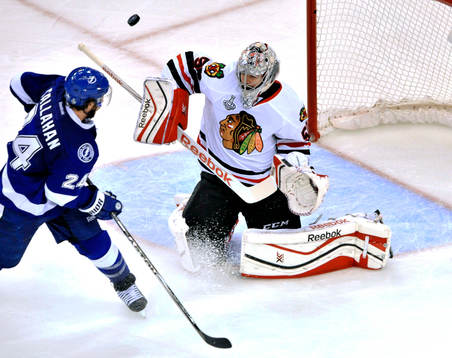 Chicago goalie Corey Crawford (50) deflects a shot from