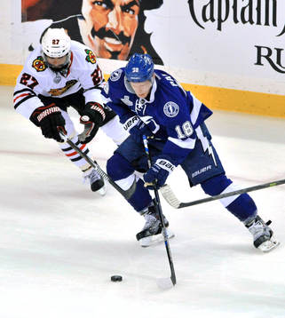 Chicago defenseman Johnny Oduya (27) pressures Tampa Bay's