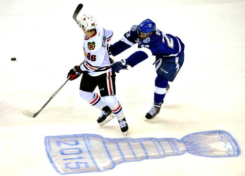 Tampa Bay's J.T. Brown (23) checks Chicago's Teuvo