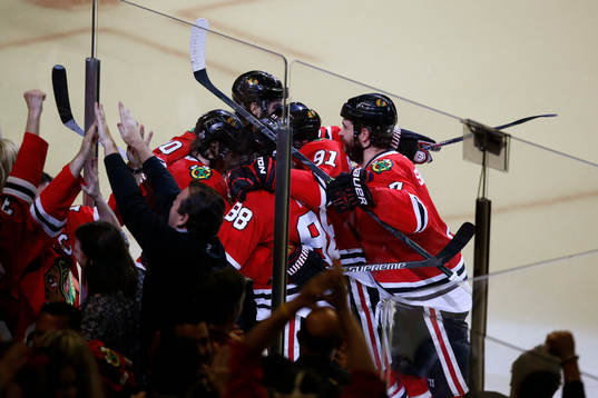 Chicago Blackhawks player celebrate Duncan Keith's goal