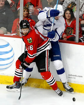 Chicago Blackhawks center Marcus Kruger (16) and Tampa Bay