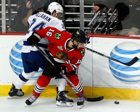 Chicago Blackhawks center Marcus Kruger (16) battles Tampa