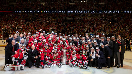 Chicago Blackhawks players pose with the Stanley Cup