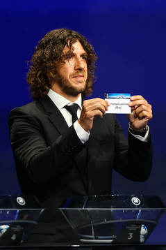 Carles Puyol drar Lyon