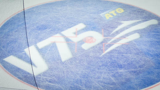 En tekningscirkel med V75 logotyp