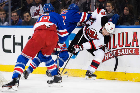 New Yorks Dan Boyle tacklar New Jerseys Jacob Josefson