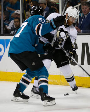 Pittsburgh Penguins defenseman Ian Cole (28) battles with