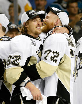 Pittsburgh Penguins left wing Carl Hagelin, left, and