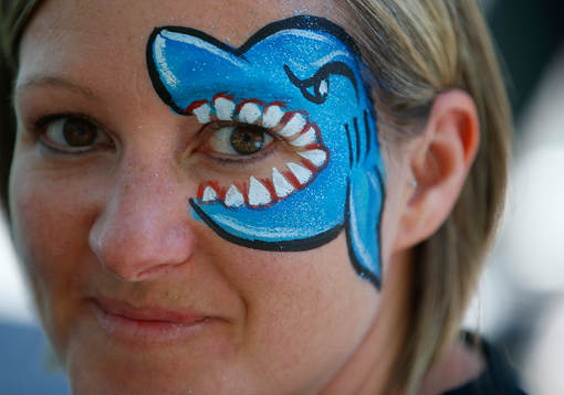 A Sharks fan decorates her face