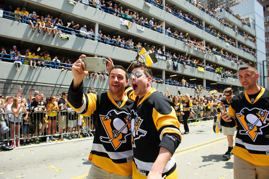 Members of the Pittsburgh Penguins ice crew pose for a