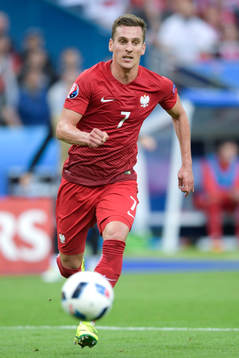 Polens Arkadiusz Milik i fotbollsmatchen mellan Tyskland