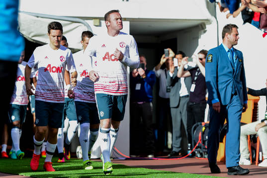 Manchester Uniteds Wayne Rooney före fotbollsmatchen