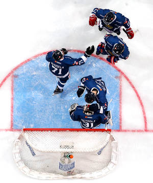 Finland¥s Kristian Kuusela and Finland¥s goalie Juha