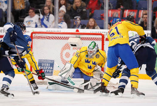 Sweden¥s goalie Niklas Svedberg and Sweden¥s Jonas