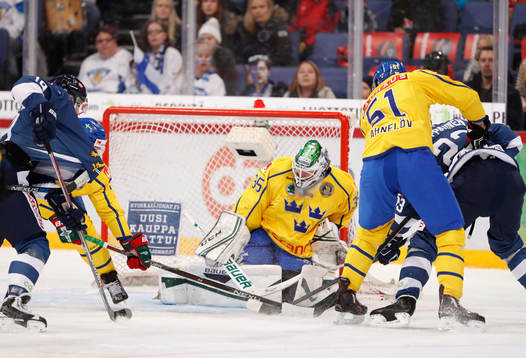 Sweden¥s goalie Niklas Svedberg and Sweden¥s Jonas