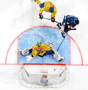 Sweden¥s Henrik Tömmernes and Sweden¥s goalie Niklas