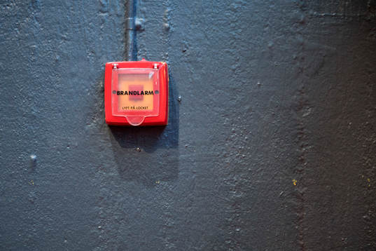 En knapp för att utlösa brandlarmet i Scandinavium
