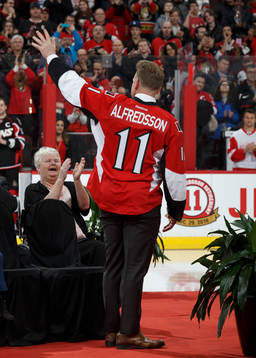 Daniel Alfredsson has his jersey with his number 11 retired