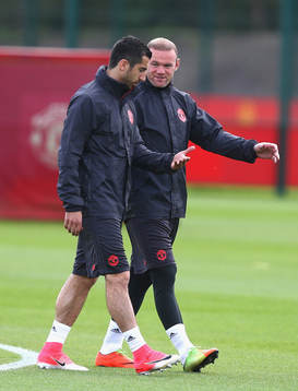 Wayne Rooney of Manchester United and Henrikh Mkhitaryan of