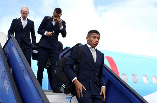 David Neres of Ajax arrives with team mates