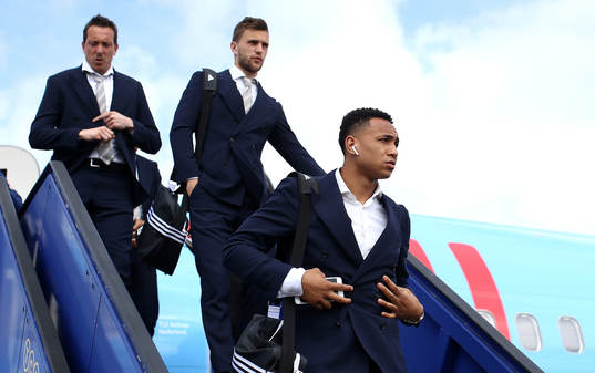 Kenny Tete of Ajax arrives with team mates