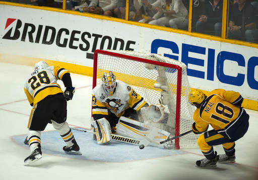 Pittsburgh Penguins goalie Matt Murray makes a save off of