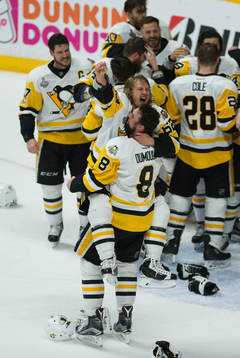 The Pittsburgh Penguins celebrate winning the Stanley Cup