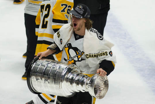 Pittsburgh Penguins Carl Hagelin lifts the Stanley Cup
