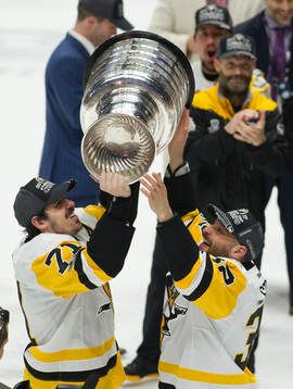 Pittsburgh Penguins Evgeni Malkin passed the cup to Mark