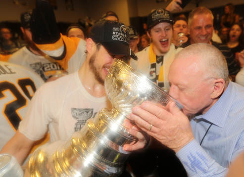 Captain Sidney Crosby #87 of the Pittsburgh Penguins helps