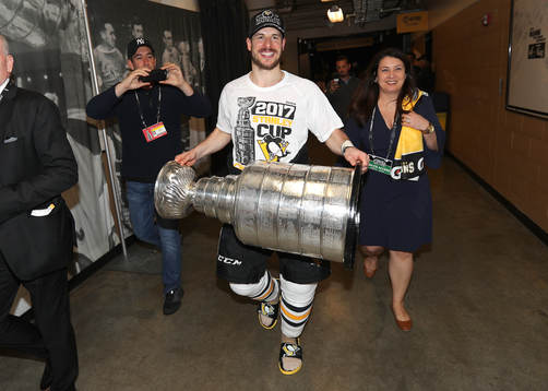 Captain Sidney Crosby #87 of the Pittsburgh Penguins brings