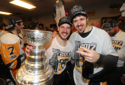 Captain Sidney Crosby #87 and Evgeni Malkin #71 of the