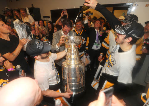 Evgeni Malkin #71 of the Pittsburgh Penguins pores a drink