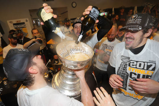 Nick Bonino #13 of the Pittsburgh Penguins pours champagne