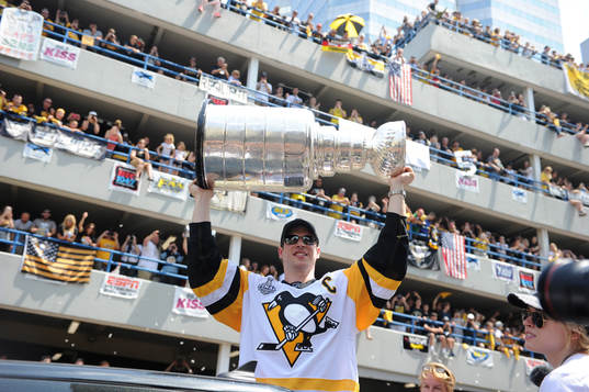 Pittsburgh Penguins' Sidney Crosby lifts the Stanley Cup