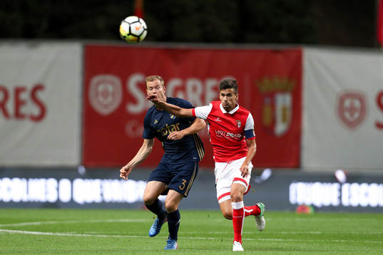 Per Karlsson defender of AIK (L) vies with Rui Fonte