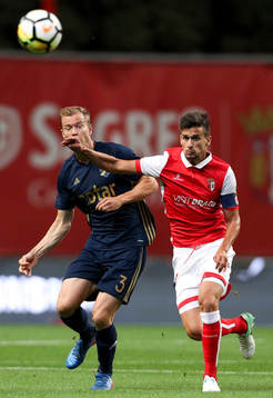 Per Karlsson defender of AIK (L) vies with Rui Fonte