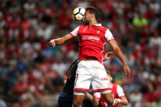 Ahmed Hassan forward of SC Braga (R) vies with Nils-Eric