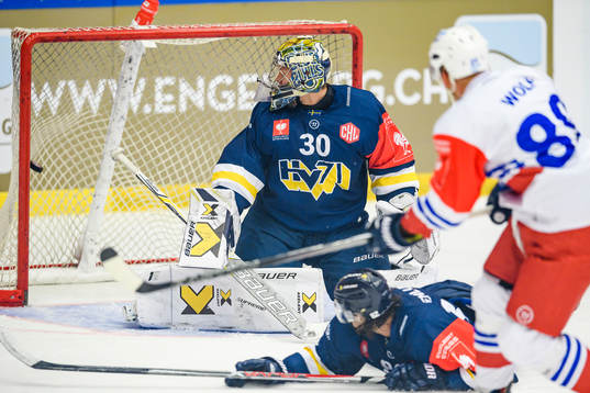 David Wolf of Adler Mannheim scores the 0-2 goal behind