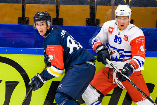Pierre Engvall of HV71 and David Wolf of Adler Mannheim